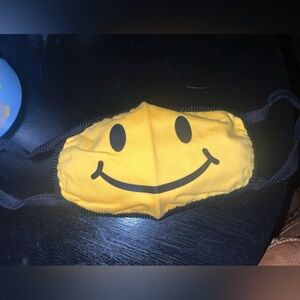 15- Tipsy Elves Yellow Smiley Face Mask